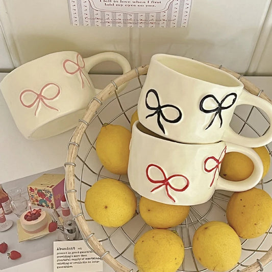 Taza con forma de lazo para niñas de aspecto alto, taza de agua de cerámica para el hogar
